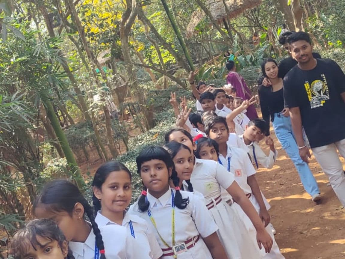 Group of students on a nature walk in a park.