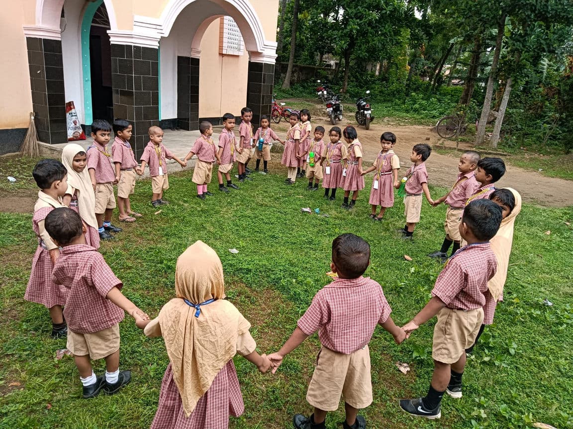 Children playing on grass.